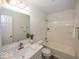 Bathroom featuring a vanity with a marble countertop, a mirror, and a shower-tub combo at 4363 Rhapsody Ln, Indianapolis, IN 46235