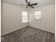 Bright bedroom with neutral walls, carpet flooring, two windows, and a ceiling fan at 4363 Rhapsody Ln, Indianapolis, IN 46235