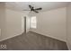 Carpeted bedroom with neutral walls, window, ceiling fan, and a closet at 4363 Rhapsody Ln, Indianapolis, IN 46235