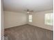 Large bedroom featuring ceiling fan, two windows, and plush gray carpet at 4363 Rhapsody Ln, Indianapolis, IN 46235