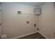 Laundry room with white walls, wire rack, and wood-look flooring at 4363 Rhapsody Ln, Indianapolis, IN 46235