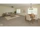 Stylishly furnished living and dining areas with modern decor and abundant natural light at 4363 Rhapsody Ln, Indianapolis, IN 46235