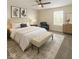 Cozy main bedroom with natural light, neutral paint, and ceiling fan at 4363 Rhapsody Ln, Indianapolis, IN 46235
