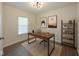 Modern office with a wood desk, stylish décor, and ample natural light at 4363 Rhapsody Ln, Indianapolis, IN 46235