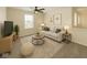 Comfortable living room with a ceiling fan, sofa, and neutral decor offers a relaxing space at 4363 Rhapsody Ln, Indianapolis, IN 46235