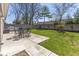 Spacious backyard featuring a concrete patio, dining table with chairs, and a built-in grill at 445 W 86Th St, Indianapolis, IN 46260