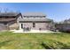 A large backyard featuring a patio with a table, chairs, and built-in grill at 445 W 86Th St, Indianapolis, IN 46260