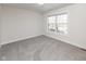 Bright, carpeted bedroom with a large window at 445 W 86Th St, Indianapolis, IN 46260