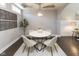 Cozy dining room featuring dark wood floors, neutral paint, and modern light fixture at 445 W 86Th St, Indianapolis, IN 46260
