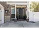 Elegant front entrance with black door, decorative columns, and potted plants for added curb appeal at 445 W 86Th St, Indianapolis, IN 46260
