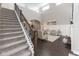 Elegant living room featuring a staircase, hardwood floors, and comfortable seating, creating a welcoming atmosphere at 445 W 86Th St, Indianapolis, IN 46260