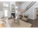 Living room with fireplace, high ceilings, hardwood floors and neutral furniture for comfortable seating at 445 W 86Th St, Indianapolis, IN 46260