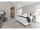 Relaxing main bedroom with a vaulted ceiling, plush carpet, and access to the backyard at 445 W 86Th St, Indianapolis, IN 46260