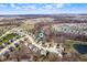 Aerial view of a neighborhood with lush greenery, ponds, and well-maintained houses at 4846 Shakamak Ct, Indianapolis, IN 46239