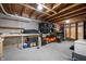 Unfinished basement featuring storage, workbench area, and exposed ceiling at 4846 Shakamak Ct, Indianapolis, IN 46239