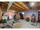 Unfinished basement space ready for customization, featuring workout equipment and storage at 4846 Shakamak Ct, Indianapolis, IN 46239