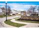 Community entrance sign at Wolf Run with stone base surrounded by landscaped lawn and neighborhood homes at 4846 Shakamak Ct, Indianapolis, IN 46239