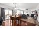 Bright dining area with access to deck, open to living room with fireplace and large windows for natural light at 4846 Shakamak Ct, Indianapolis, IN 46239