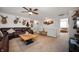 Upstairs living area with comfortable seating, featuring deer mounts on the walls and a ceiling fan at 4846 Shakamak Ct, Indianapolis, IN 46239