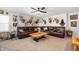Upstairs living area featuring comfortable seating and notable decor, including multiple deer mounts on the walls at 4846 Shakamak Ct, Indianapolis, IN 46239