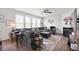 Spacious living room with large windows, fireplace, ceiling fan, and modern decor for a comfortable atmosphere at 4846 Shakamak Ct, Indianapolis, IN 46239