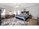 Spacious main bedroom with high ceilings, natural light, and a large bed and stylish decor at 4846 Shakamak Ct, Indianapolis, IN 46239