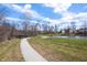 Enjoy the paved walking path around the pond, perfect for outdoor recreation at 4846 Shakamak Ct, Indianapolis, IN 46239