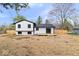 Modern home with a new wooden deck, and ample backyard space under a clear sky at 4921 Cottonwood N Ct, Columbus, IN 47203