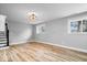 Basement space showcasing hardwood floors and ample natural light from multiple windows at 4921 Cottonwood N Ct, Columbus, IN 47203