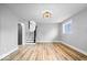 Partially finished basement showcasing modern stairs, new flooring and natural light at 4921 Cottonwood N Ct, Columbus, IN 47203