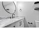 Bathroom featuring granite countertop, modern fixtures, and sleek vanity for a contemporary look at 4921 Cottonwood N Ct, Columbus, IN 47203