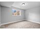 Cozy bedroom with neutral walls, carpet flooring, white trim, and a window for natural light at 4921 Cottonwood N Ct, Columbus, IN 47203