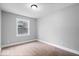 Bedroom featuring neutral walls, carpet flooring, white trim, and a window for natural light at 4921 Cottonwood N Ct, Columbus, IN 47203