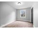 Cozy bedroom with neutral walls, carpet flooring, and a window offering natural light at 4921 Cottonwood N Ct, Columbus, IN 47203