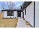 Stylish home featuring contrasting black and white accents with a well-manicured lawn at 4921 Cottonwood N Ct, Columbus, IN 47203