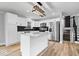 Stylish kitchen with stainless steel appliances, island with granite counters, and modern light fixture at 4921 Cottonwood N Ct, Columbus, IN 47203