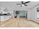 Open floor plan combining a modern kitchen and a living area with stairs and a functional mudroom at 4921 Cottonwood N Ct, Columbus, IN 47203