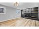 Cozy living room featuring modern fireplace, hardwood floors, and ample natural light at 4921 Cottonwood N Ct, Columbus, IN 47203
