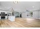 Bright and airy living space with kitchen, mudroom, staircase, and window, seamlessly blending modern design and comfort at 4921 Cottonwood N Ct, Columbus, IN 47203