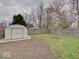 Fenced backyard with shed offers private outdoor space, perfect for relaxing or entertaining at 501 W Pearl St, Trafalgar, IN 46181