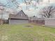 Spacious backyard surrounded by a wooden fence, providing privacy and a secure area for outdoor activities and relaxation at 501 W Pearl St, Trafalgar, IN 46181