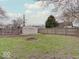 Large, fenced backyard features a storage shed and plenty of green space at 501 W Pearl St, Trafalgar, IN 46181