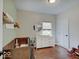 Bright Bedroom features a crib, changing table with dresser, and a classic wooden rocking horse, creating a cozy space at 501 W Pearl St, Trafalgar, IN 46181
