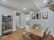 Bright dining room with live-edge table, decor, and view to the adjacent modern kitchen at 501 W Pearl St, Trafalgar, IN 46181