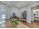 Dining room featuring wood floors, stylish décor, and access to an adjacent powder room at 501 W Pearl St, Trafalgar, IN 46181