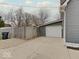 Attached one car garage accessible by a concrete driveway and fenced yard at 501 W Pearl St, Trafalgar, IN 46181