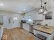 Spacious kitchen with white cabinets, butcher block countertops, and stainless steel appliances at 501 W Pearl St, Trafalgar, IN 46181