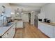 Bright, open kitchen with butcher block countertops, stainless steel appliances, and hardwood floors at 501 W Pearl St, Trafalgar, IN 46181