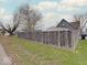 The fenced in yard offers privacy, with street parking and driveway access at 501 W Pearl St, Trafalgar, IN 46181