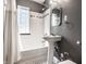 Classic bathroom with a pedestal sink, and white subway tile in the shower at 5347 N College Ave # Apt 109, Indianapolis, IN 46220